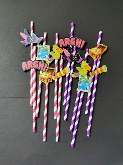 Decorative straws with cartoon characters and 'ARGH!' text on a dark background