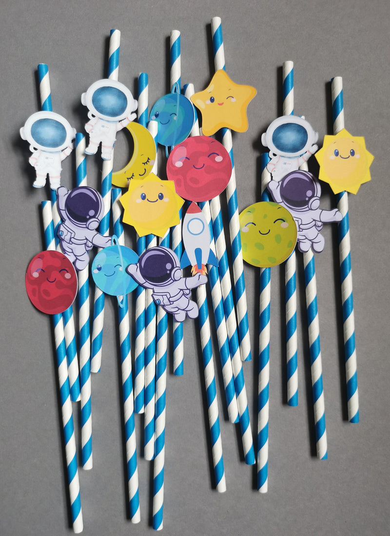 Straw decorations with cartoon solar system characters on a gray background