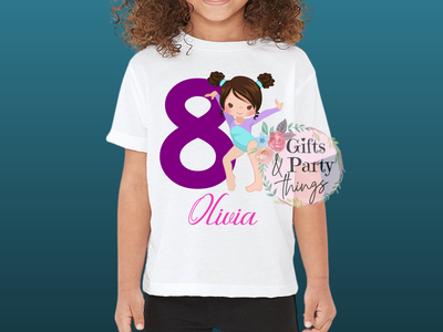 Child wearing a white t-shirt with a birthday design featuring a number 8 and a gymnast girl's silhouette.