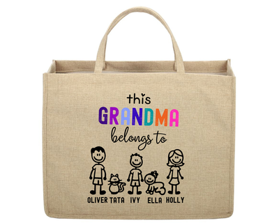 Beige tote bag with colorful text and stick figure family design on a white background