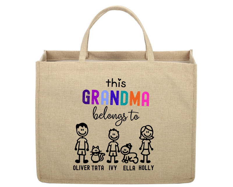 Beige tote bag with colorful text and stick figure family design on a white background