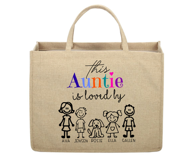 Beige tote bag with colorful text and stick figure illustrations on a white background