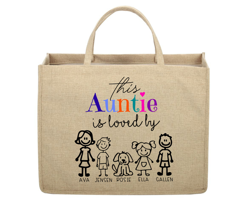 Beige tote bag with colorful text and stick figure illustrations on a white background