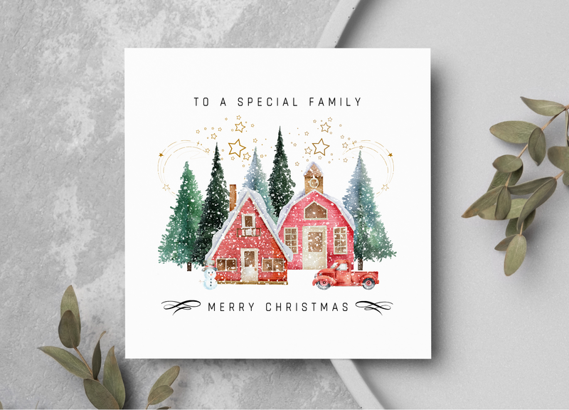 Christmas card showing pine trees, houses, truck and snowman.