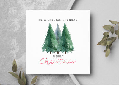 Christmas card showing three pine trees.