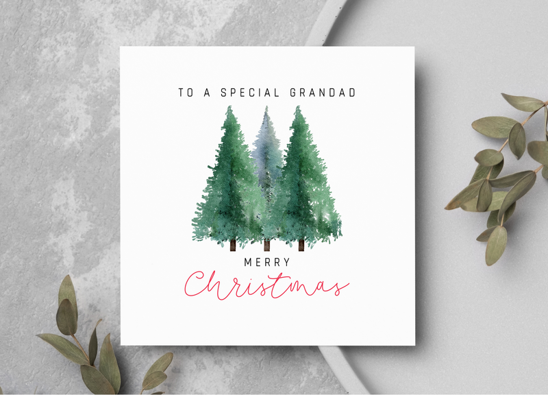 Christmas card showing three pine trees.