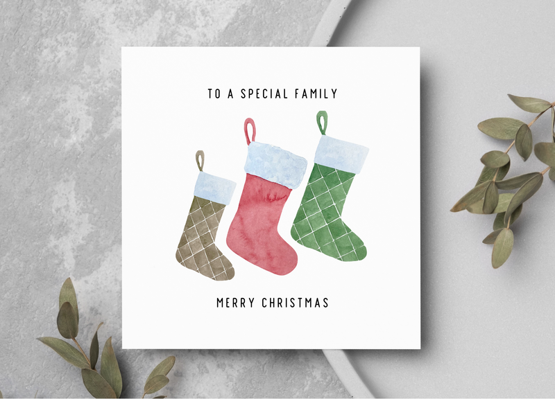 Christmas card with stockings and text &