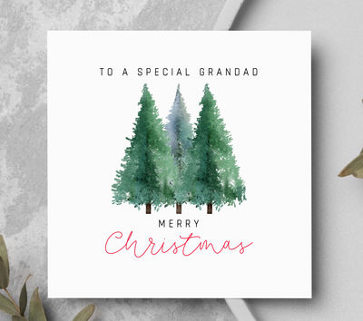 Christmas card showing three pine trees.