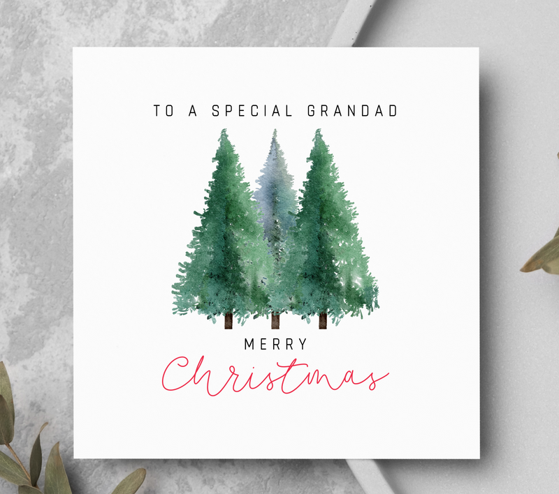 Christmas card showing three pine trees.