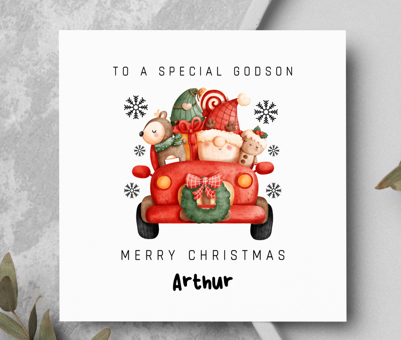 Christmas card with a red truck and Santa Claus, personalized for a godson named Arthur.