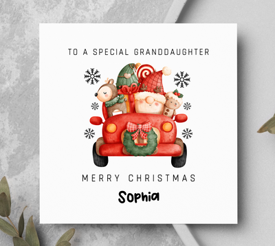 Christmas card with a red truck and Santa Claus, personalized for a special granddaughter.