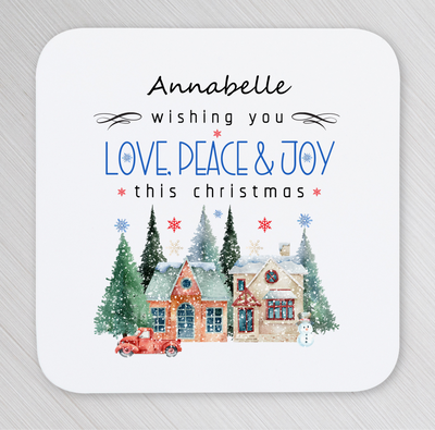 A snowing Christmas scenery with two buildings, pine trees, snowman and a red truck.