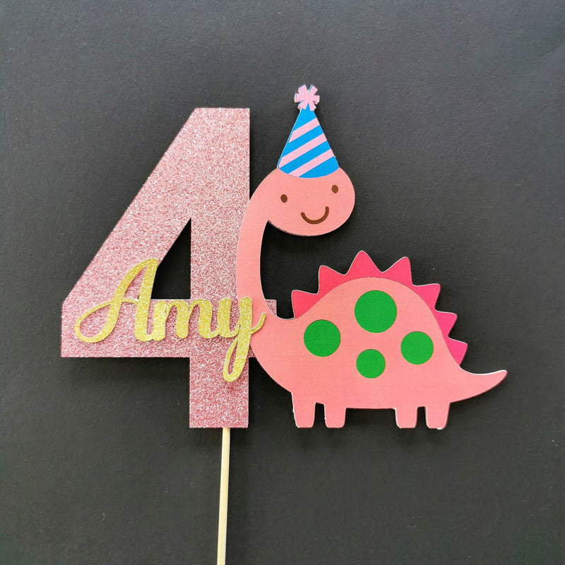 Pink dinosaur cake topper