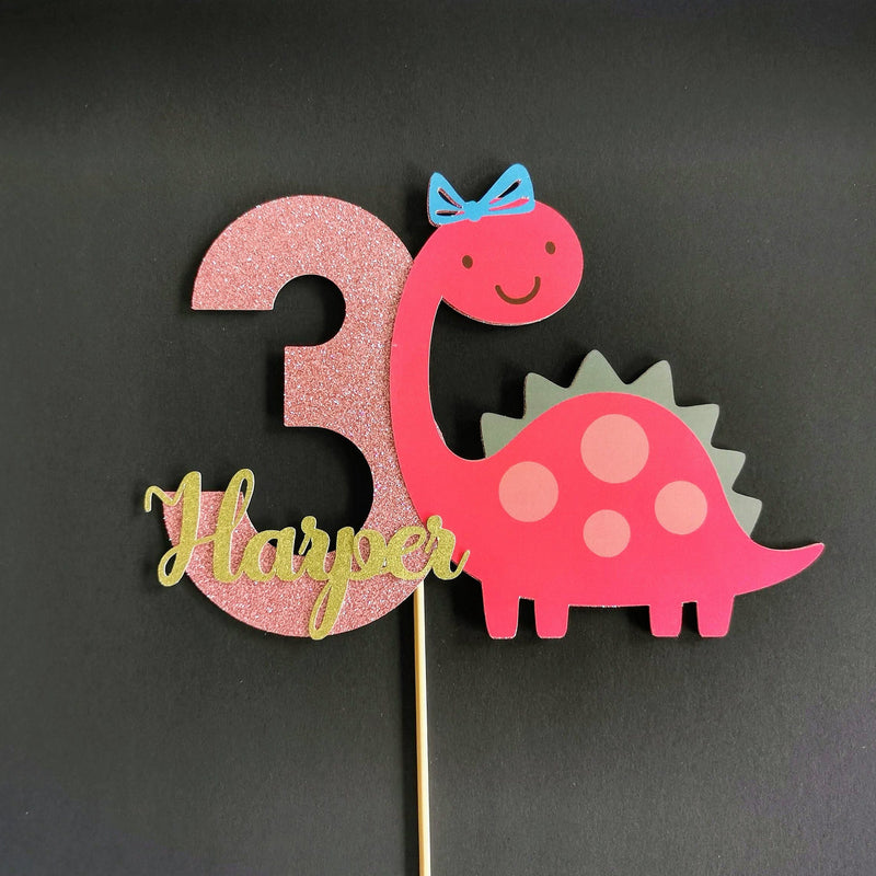 Pink dinosaur cake topper