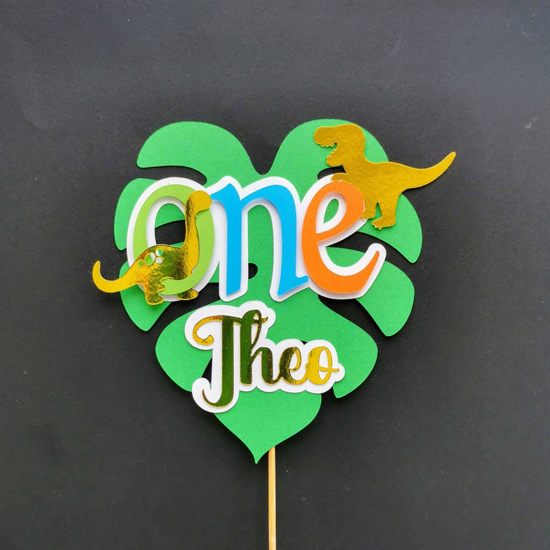 dinosaur and leaf cake topper
