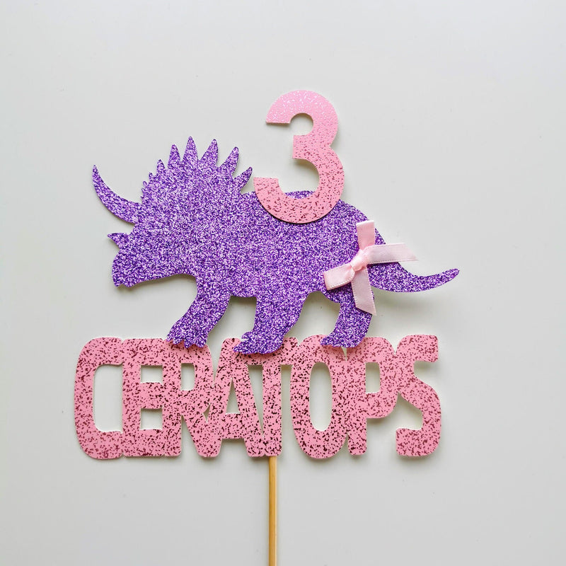 Pink dinosaur cake topper